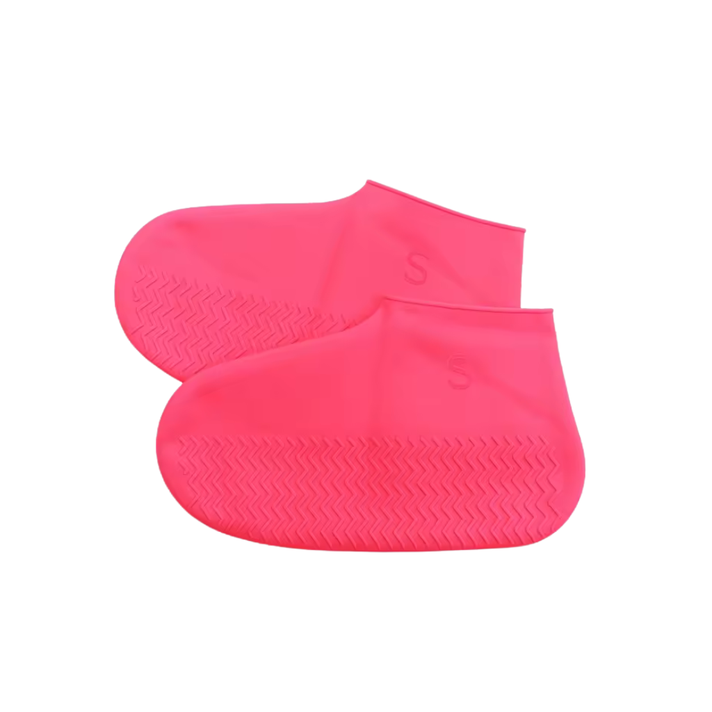 Two pink silicone shoe covers on a white background
